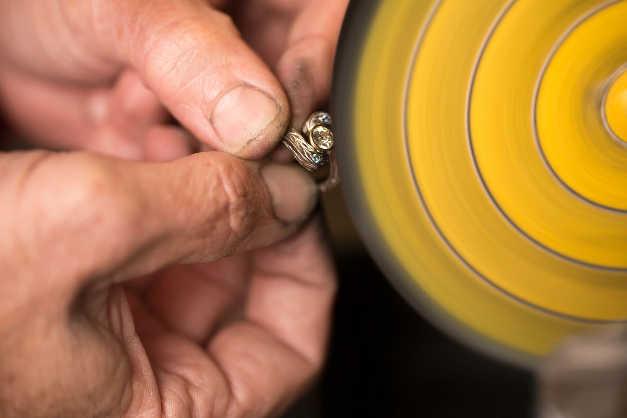 Jeweller working carefully on a ring